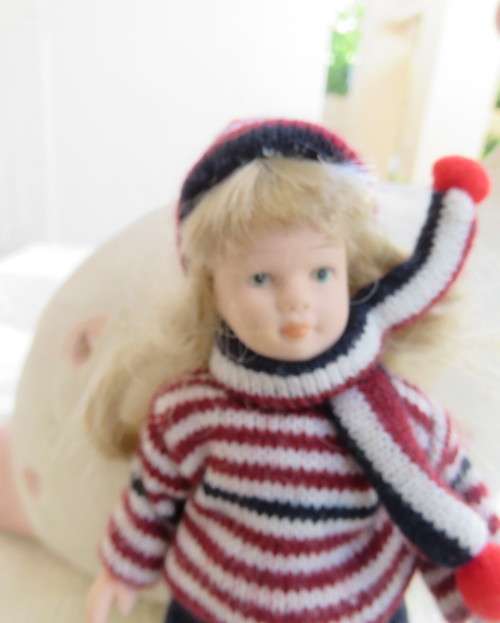 Antique doll 16cm tall with clothing. See scans. Very good condition