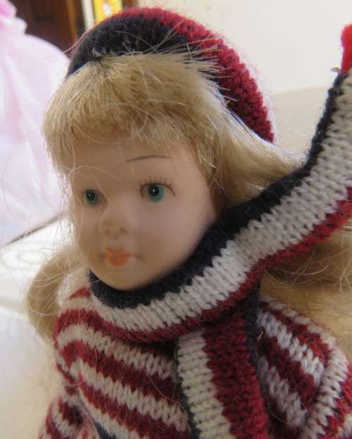 Antique doll 16cm tall with clothing. See scans. Very good condition