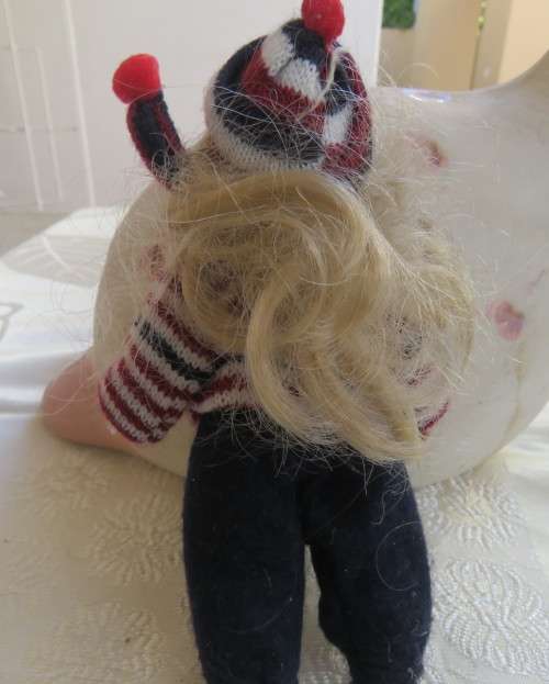 Antique doll 16cm tall with clothing. See scans. Very good condition