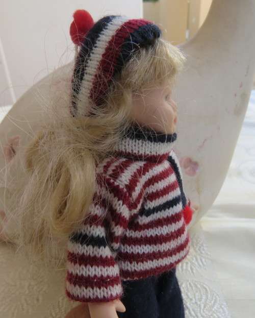 Antique doll 16cm tall with clothing. See scans. Very good condition