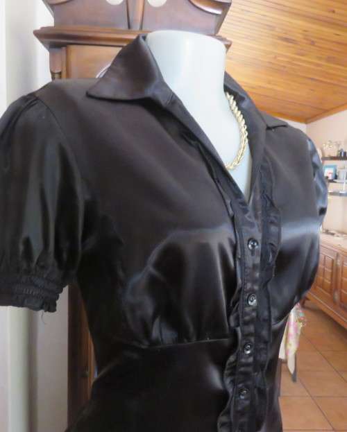 As new black shiny/stretch satin/polyester button down top.V and collar.Empire front.OASIS 34