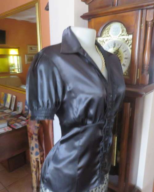 As new black shiny/stretch satin/polyester button down top.V and collar.Empire front.OASIS 34
