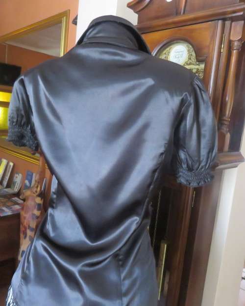 As new black shiny/stretch satin/polyester button down top.V and collar.Empire front.OASIS 34