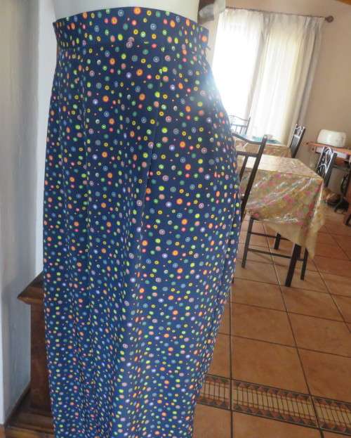 Beautiful Boutique made 2 pc polyester w/w pant suit.Navy with colourful dots.Size 40 to 42.As new