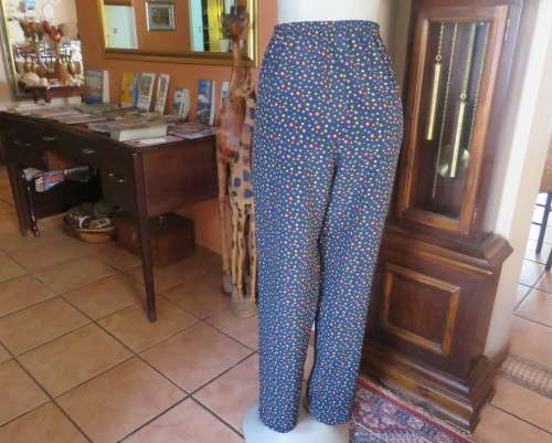 Beautiful Boutique made 2 pc polyester w/w pant suit.Navy with colourful dots.Size 40 to 42.As new