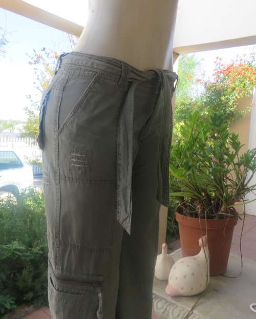 Vintage authentic 100% cotton. Wash out distressed look.Sage green.Pockets and stitching galore. 34.