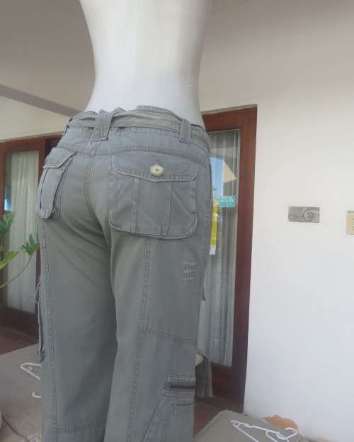 Vintage authentic 100% cotton. Wash out distressed look.Sage green.Pockets and stitching galore. 34.