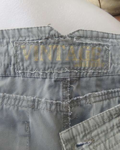 Vintage authentic 100% cotton. Wash out distressed look.Sage green.Pockets and stitching galore. 34.
