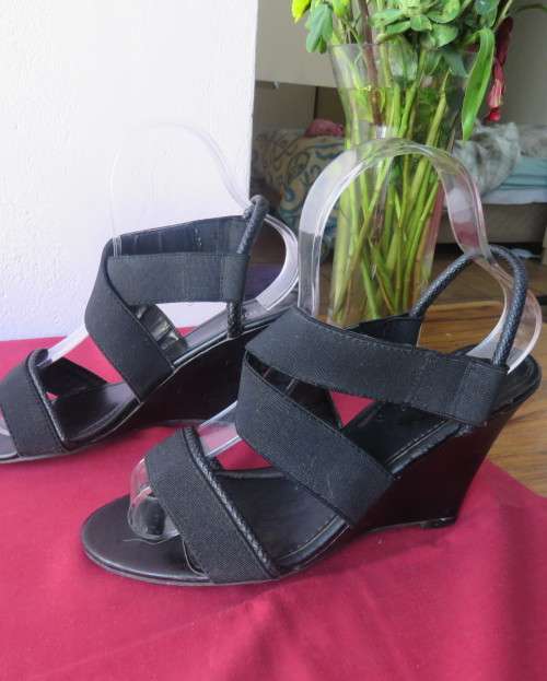 Pair black wedge heel sandals with ankle and crossover straps. Open toes.Size 5 by MRP.As new