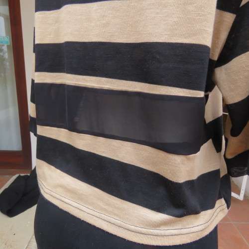 Real beaut! Black/rich cream horizontal stripes. Sheer black sleeve edging and back inlay.Size 38.