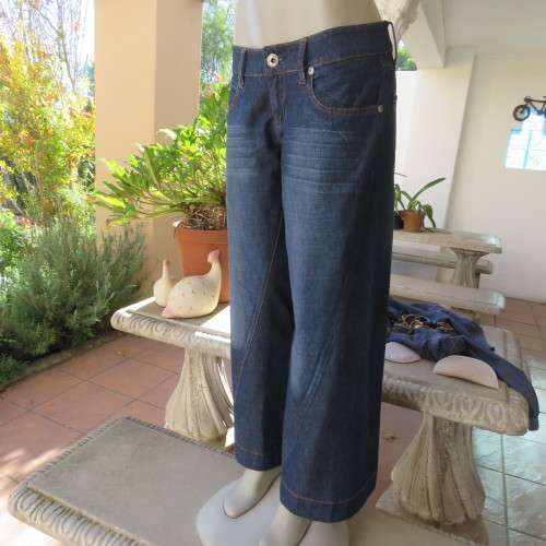 Low rise fashion blue denim jeans. Wide legged. 100% cotton.By RT size 36/12. New condition
