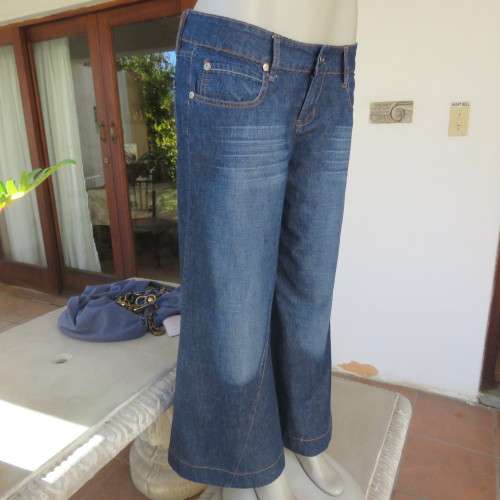Low rise fashion blue denim jeans. Wide legged. 100% cotton.By RT size 36/12. New condition