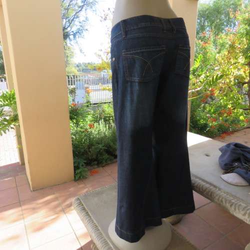 Low rise fashion blue denim jeans. Wide legged. 100% cotton.By RT size 36/12. New condition