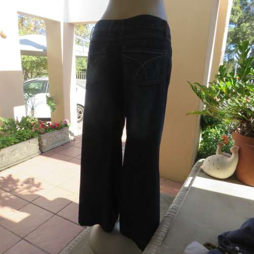Low rise fashion blue denim jeans. Wide legged. 100% cotton.By RT size 36/12. New condition