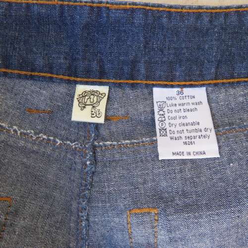 Low rise fashion blue denim jeans. Wide legged. 100% cotton.By RT size 36/12. New condition