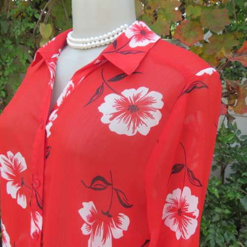 Eye catching red with white floral long top in sheer polyester. Cuffed sleeves. Size 36 by MILADY`S.