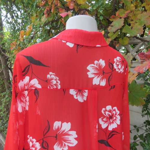 Eye catching red with white floral long top in sheer polyester. Cuffed sleeves. Size 36 by MILADY`S.