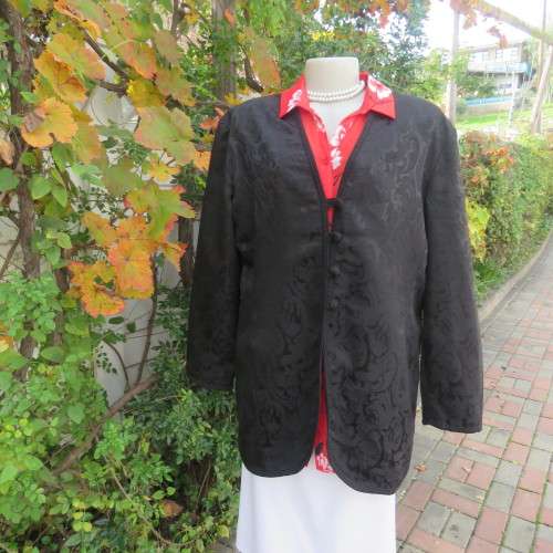 Stunning black boutique made brocade fully lined long sleeve collar less jacket. Size 42/18.New cond