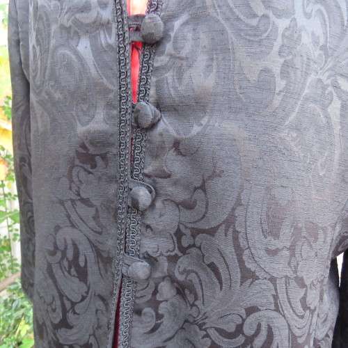 Stunning black boutique made brocade fully lined long sleeve collar less jacket. Size 42/18.New cond
