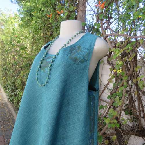 Boutique made mottled jade wide cut sleeveless top size 42. Floral inlays and decorations.