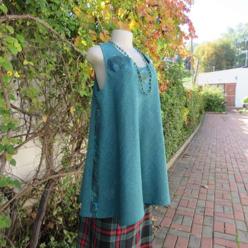 Boutique made mottled jade wide cut sleeveless top size 42. Floral inlays and decorations.