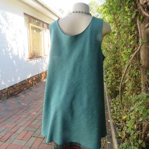 Boutique made mottled jade wide cut sleeveless top size 42. Floral inlays and decorations.