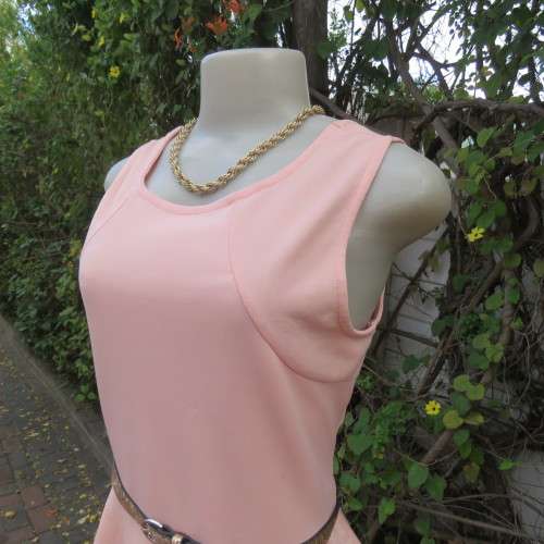 Sweet light peach stretch polyester skater style sleeveless dress by RT in size 36/12. Low back.