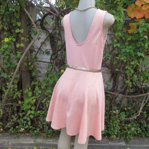 Sweet light peach stretch polyester skater style sleeveless dress by RT in size 36/12. Low back.