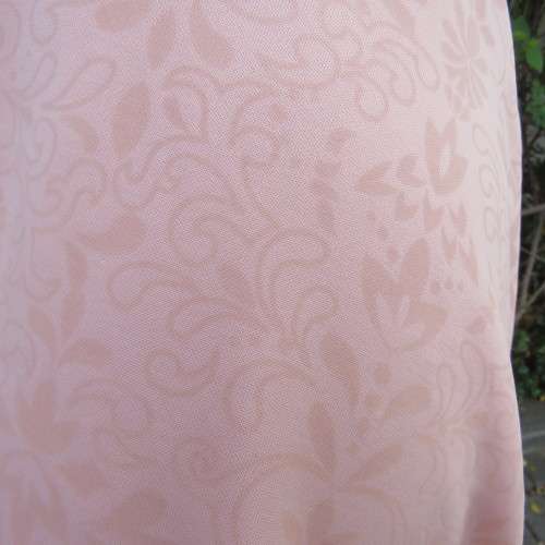 Sweet light peach stretch polyester skater style sleeveless dress by RT in size 36/12. Low back.