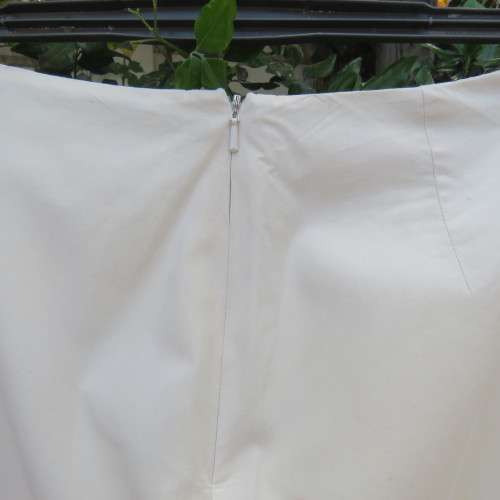 Grab this skirt! By designer VIVIENNE TAM in size 32/8. Rich cream/lined with embroidery at side.