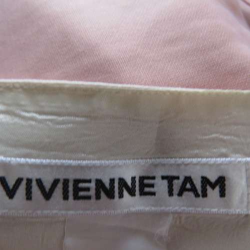 Grab this skirt! By designer VIVIENNE TAM in size 32/8. Rich cream/lined with embroidery at side.
