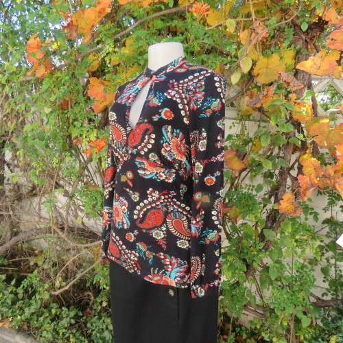 Soft black viscose stretch with paisley and floral pattern in brick/jade/cream.Size 36 by WOOLWORTHS