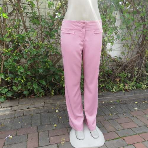 Dusty pink straight legged dress pants in rich polyester blends. Some stretch. Size 34/10. As new.