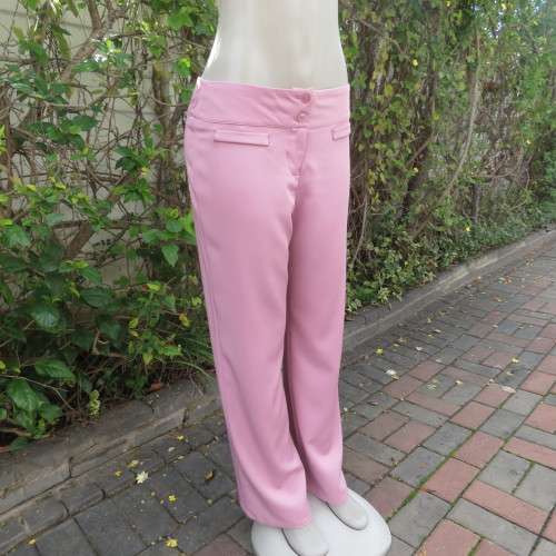 Dusty pink straight legged dress pants in rich polyester blends. Some stretch. Size 34/10. As new.