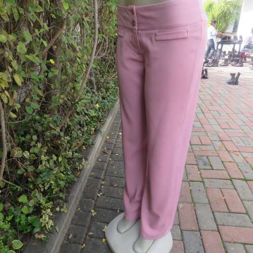 Dusty pink straight legged dress pants in rich polyester blends. Some stretch. Size 34/10. As new.