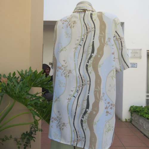 Pretty short sleeve button down/open collar top in vertical pattern lines.Soft colours.Size 48/24