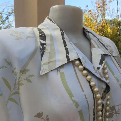 Pretty short sleeve button down/open collar top in vertical pattern lines.Soft colours.Size 48/24