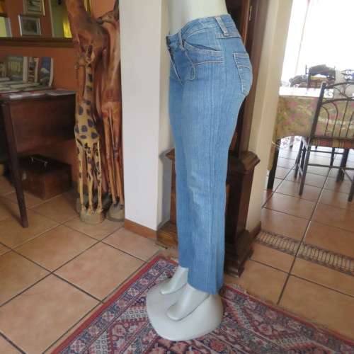 Straight legged blue ankle length jeans by WWW size 34/10. Very little stretch. Pockets back/front..