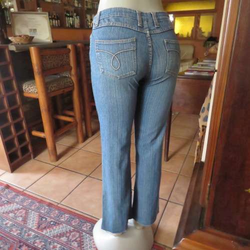 Straight legged blue ankle length jeans by WWW size 34/10. Very little stretch. Pockets back/front..