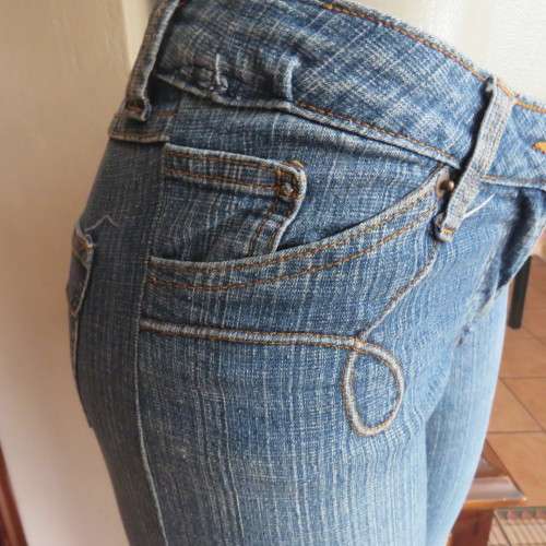 Straight legged blue ankle length jeans by WWW size 34/10. Very little stretch. Pockets back/front..