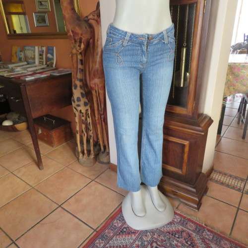 Straight legged blue ankle length jeans by WWW size 34/10. Very little stretch. Pockets back/front..