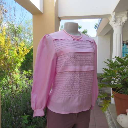 Romantic rose pink top. Long puffed sleeves and button down back.Decorative front tucking.Size 35/11