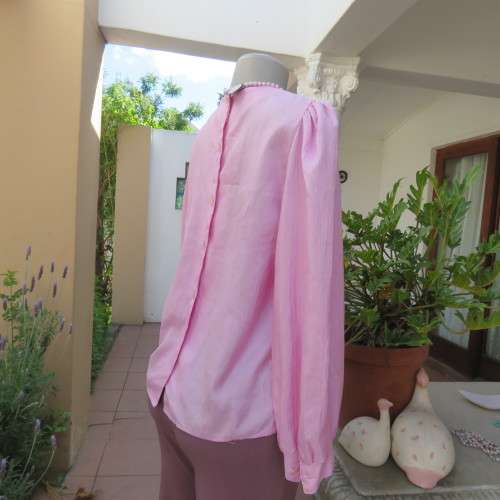 Romantic rose pink top. Long puffed sleeves and button down back.Decorative front tucking.Size 35/11