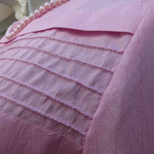 Romantic rose pink top. Long puffed sleeves and button down back.Decorative front tucking.Size 35/11