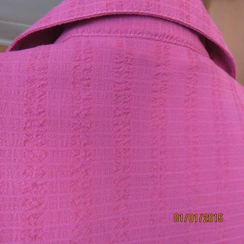 Top of the line magenta pink richly embroidered short sleeve bubble polyester top. Size 46. As new