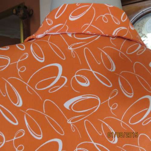 Get into summer! Crimson with white curls polyester button down boutique made top. Size 42. New cond