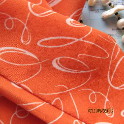 Get into summer! Crimson with white curls polyester button down boutique made top. Size 42. New cond