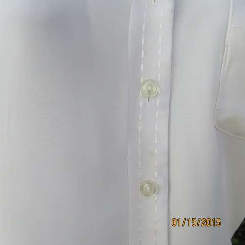 Cool sleeveless summer top in cream polyester. Pretty embroidery on collar and front.Size 36. As new