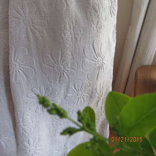 Charming light grey floral embossed poly/nylon knee length skirt.Size 36. Inverted front pleats.