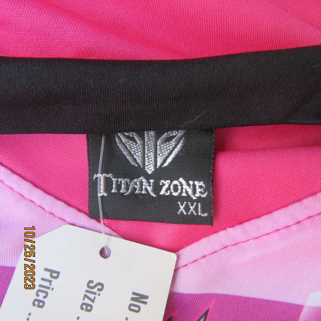 New TITAN ZONE sports slip over top in stretch polyester. Pink/yellow/black. Size 42/18. V neck.